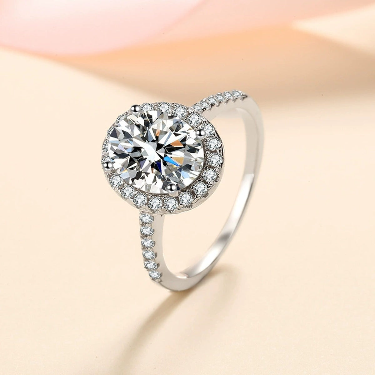 Oval Moissanite Ring with CZ worn on hand to show scale and ring profile