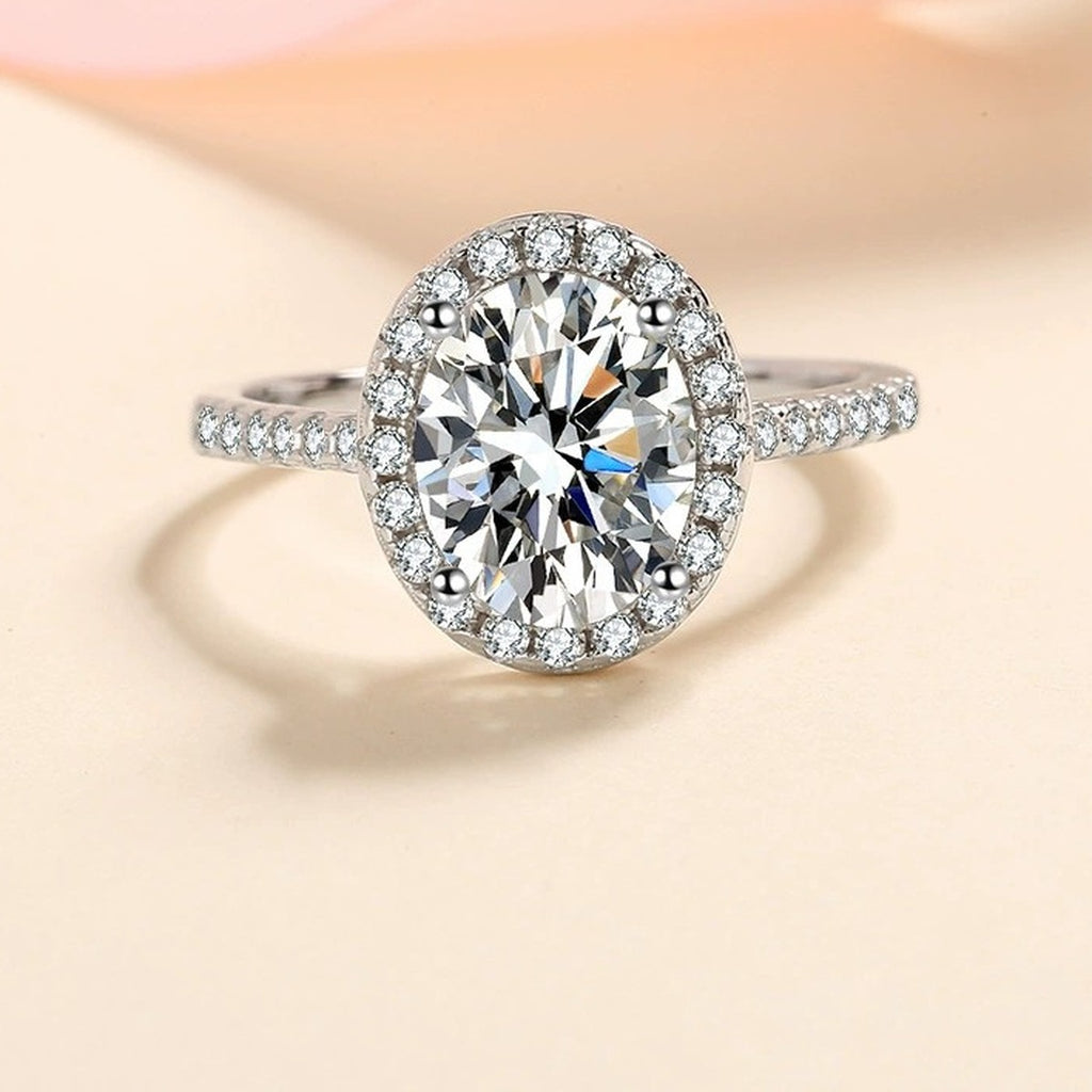 Oval Moissanite Ring with CZ worn on hand to show scale and ring profile