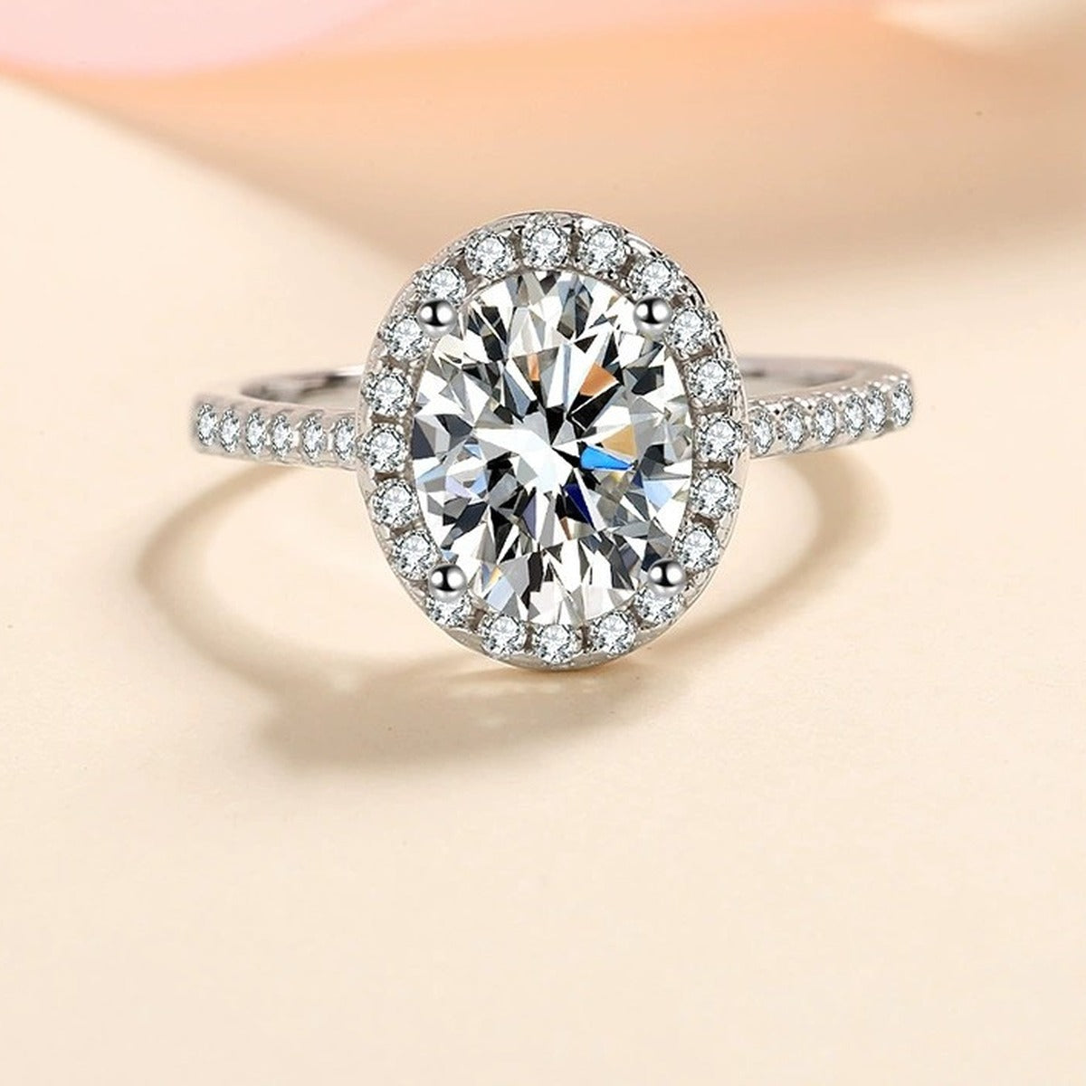 Oval Moissanite Ring with CZ worn on hand to show scale and ring profile