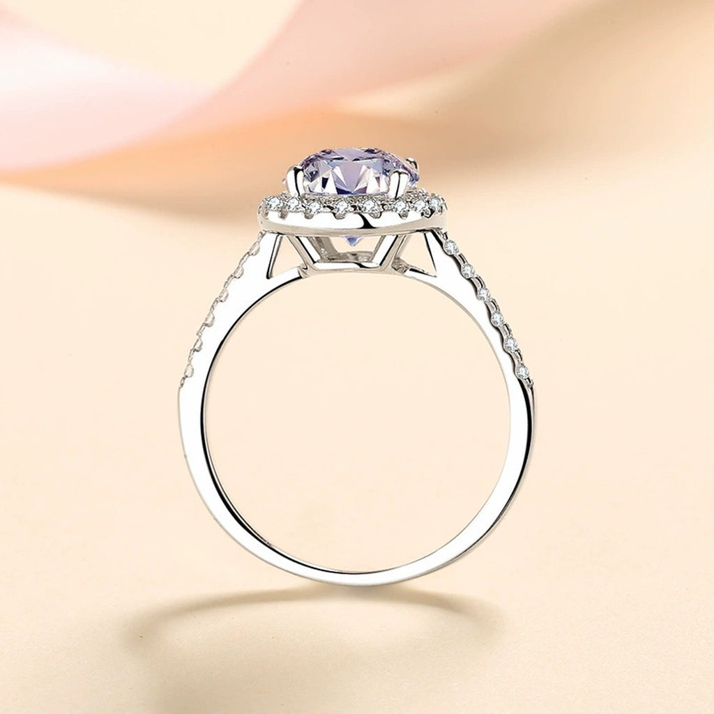 Oval Moissanite Ring with CZ worn on hand to show scale and ring profile