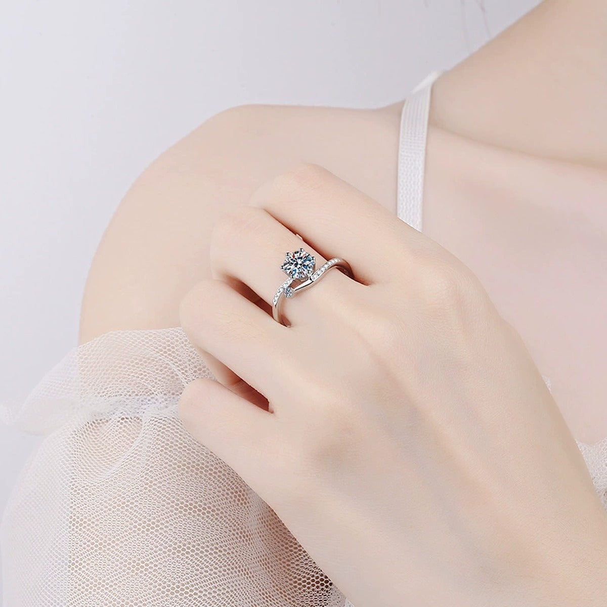 Round Moissanite Side Stone Ring with CZ worn on hand to show scale and ring profile