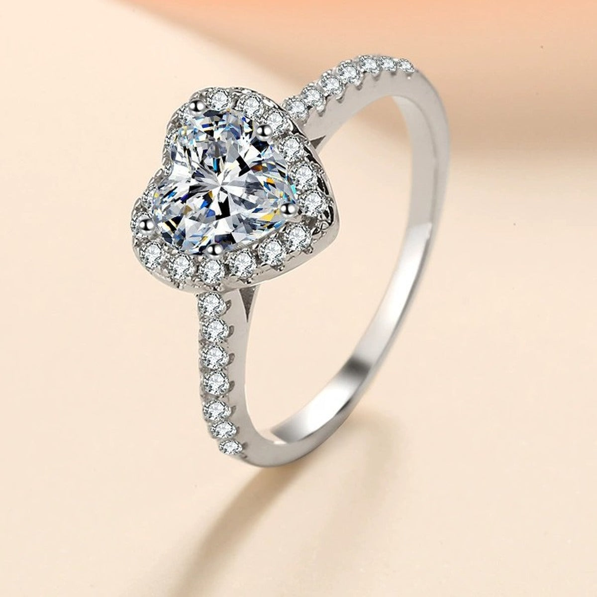 Heart Cut Moissanite Ring with CZ worn on hand to show scale and ring profile