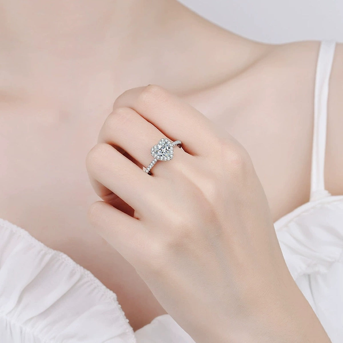 Heart Cut Moissanite Ring with CZ worn on hand to show scale and ring profile