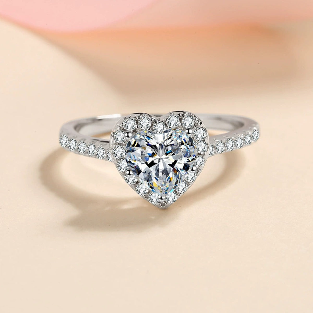 Heart Cut Moissanite Ring with CZ worn on hand to show scale and ring profile