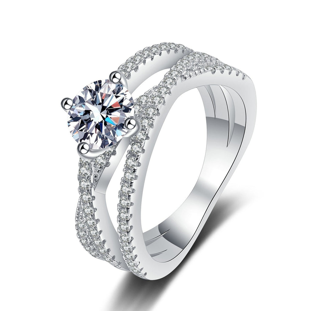 Round Moissanite Split Shank Ring with CZ in rhodium-plated S925 sterling silver on clean white background