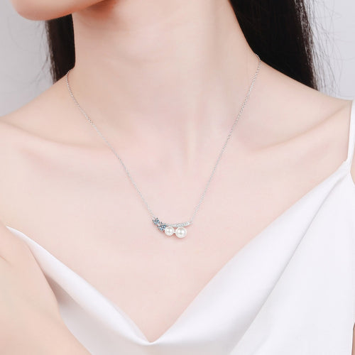 Bow Moissanite Pearl Pendant Necklace with CZ in Rhodium-Plated S925 sterling silver neckline model view showing pendant scale and adjustable chain