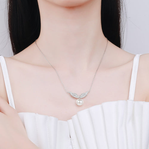 Angel Wing Moissanite Pearl Pendant Necklace in Rhodium-Plated S925 sterling silver neckline model view showing pendant scale and adjustable chain