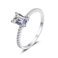 Emerald and Radiant Cut Moissanite Ring with CZ in rhodium-plated S925 sterling silver on clean white background