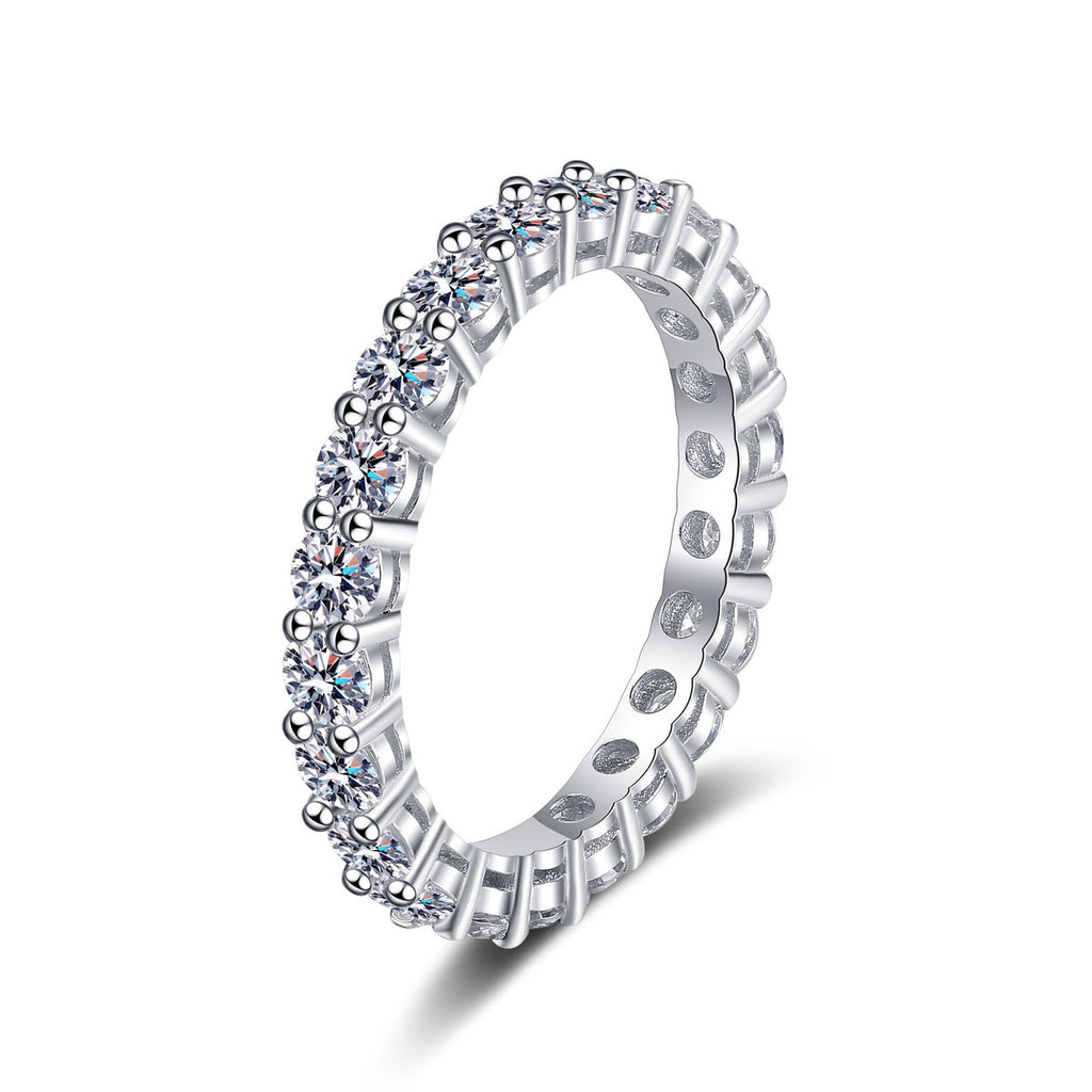 Round Moissanite Eternity Band Ring in rhodium-plated S925 sterling silver on clean white background