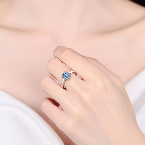 Blue Oval Moissanite Ring with CZ in Rhodium-Plated S925 Sterling Silver worn on hand, showing scale, finger coverage, and rhodium-plated finish