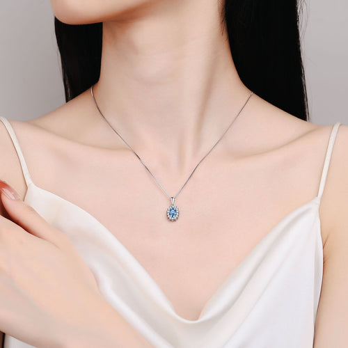 Blue Oval Moissanite Pendant Necklace with CZ in Rhodium-Plated S925 sterling silver neckline model view showing pendant scale and adjustable chain