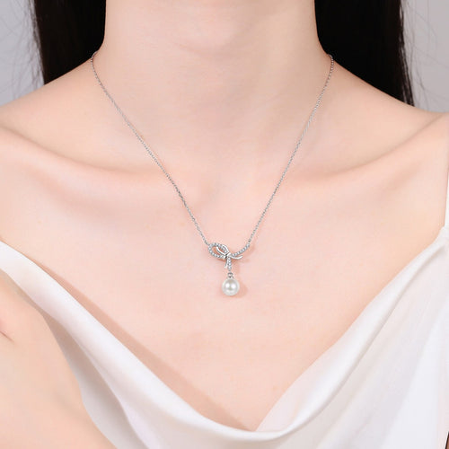 Bow Moissanite Pearl Pendant Necklace in Rhodium-Plated S925 sterling silver neckline model view showing pendant scale and adjustable chain