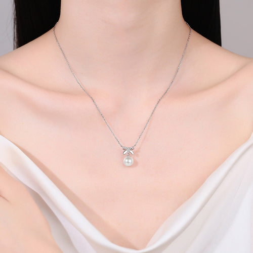 Bow Moissanite Pearl Pendant Necklace in Rhodium-Plated S925 sterling silver neckline model view showing pendant scale and adjustable chain