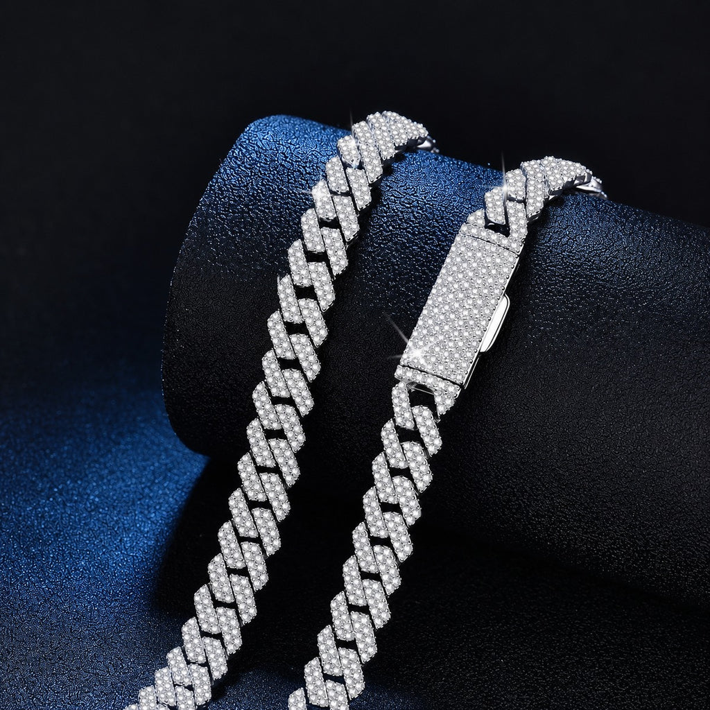 White gold-plated iced Cuban link moissanite necklace clasp and pave link detail on blue display