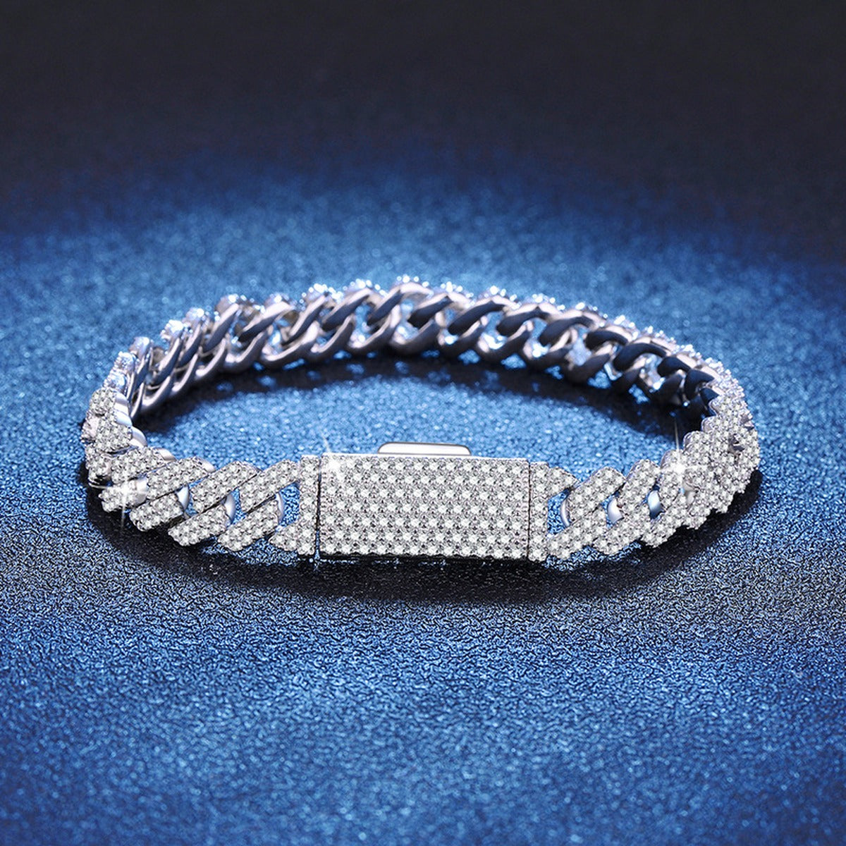 8mm Full Pave Moissanite Cuban Link Bracelet styled on blue display background showing moissanite sparkle and chain detail