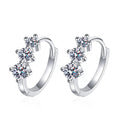 Floral Moissanite Hoop Earrings in White Gold-Plated S925 Sterling Silver on clean white background showing the pair and small floral clusters arranged along a bright huggie hoop
