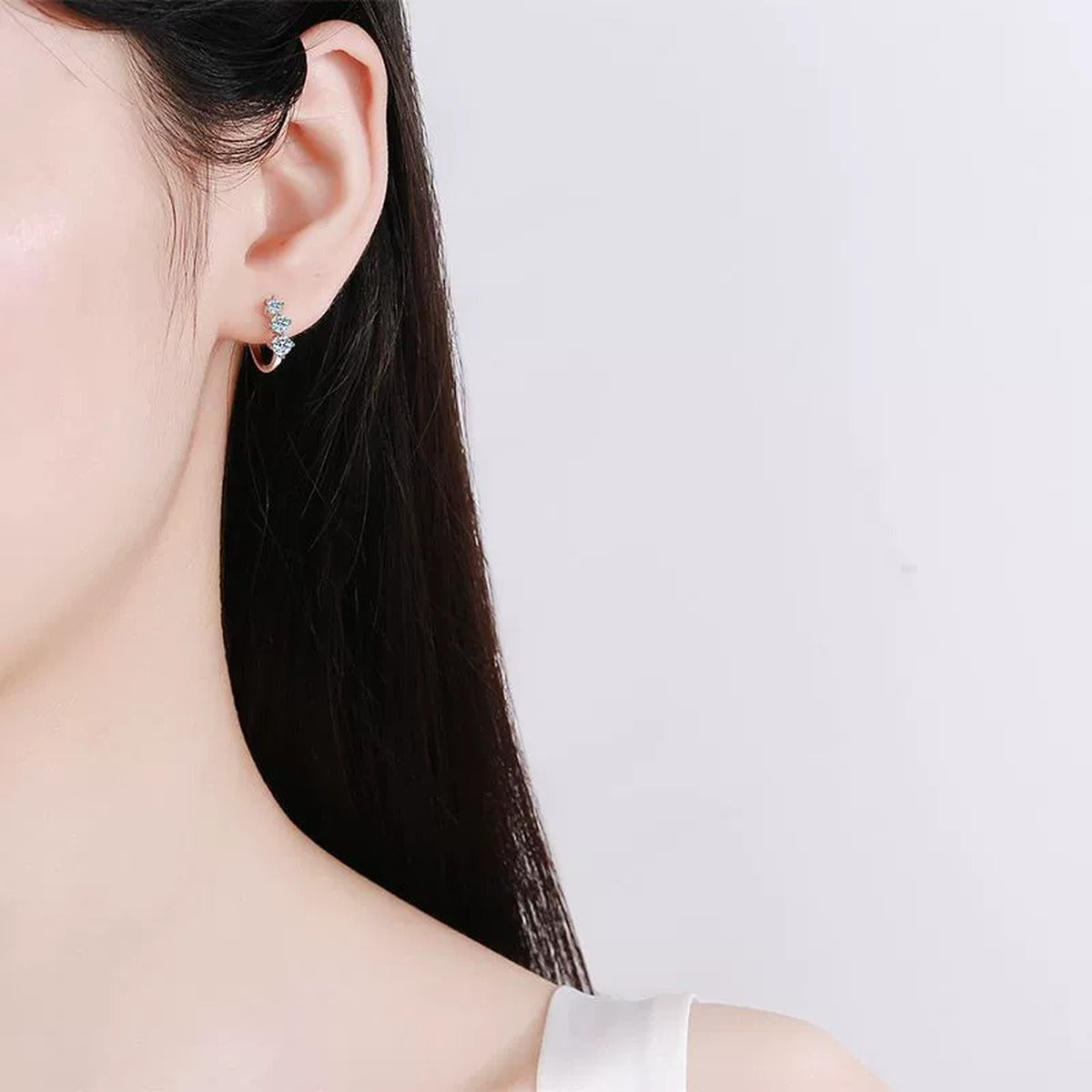 Floral Moissanite Hoop Earrings in White Gold-Plated S925 Sterling Silver worn on ear by model