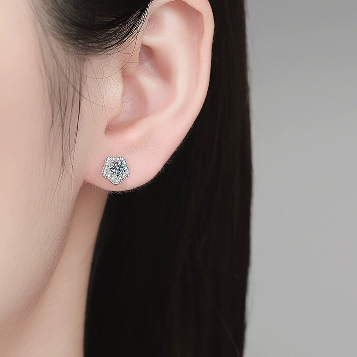 Flower Moissanite Stud Earrings with CZ in White Gold-Plated S925 Sterling Silver worn on ear by model