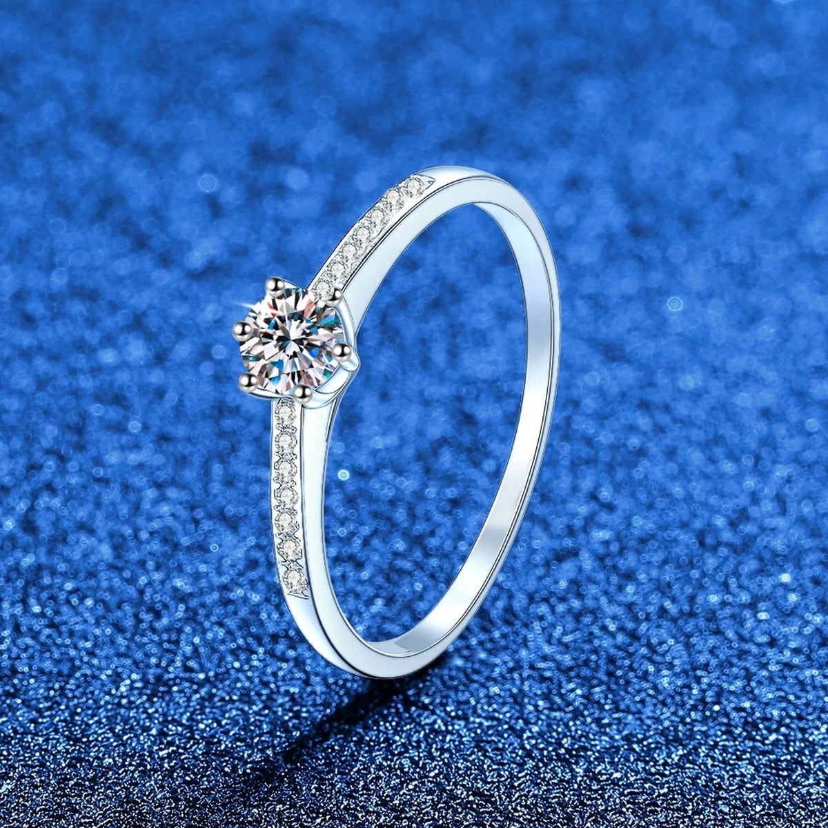 Round Moissanite Ring with CZ worn on hand by model