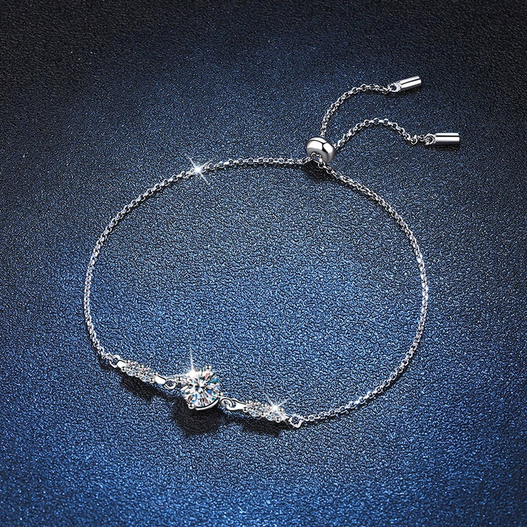 Round Moissanite Adjustable Station Bracelet with CZ styled on blue display background with visible moissanite sparkle