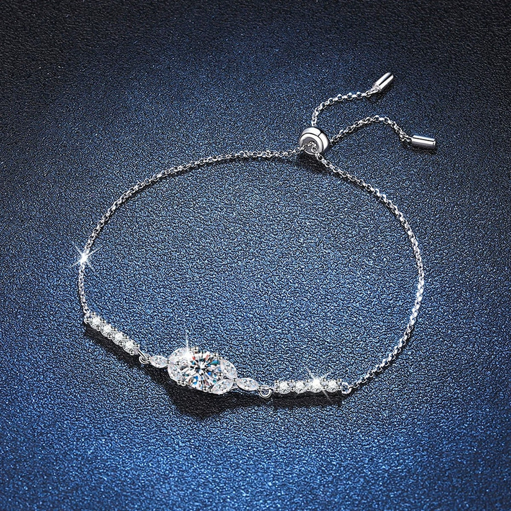 Oval Moissanite Adjustable Station Bracelet with CZ styled on blue display background with visible moissanite sparkle