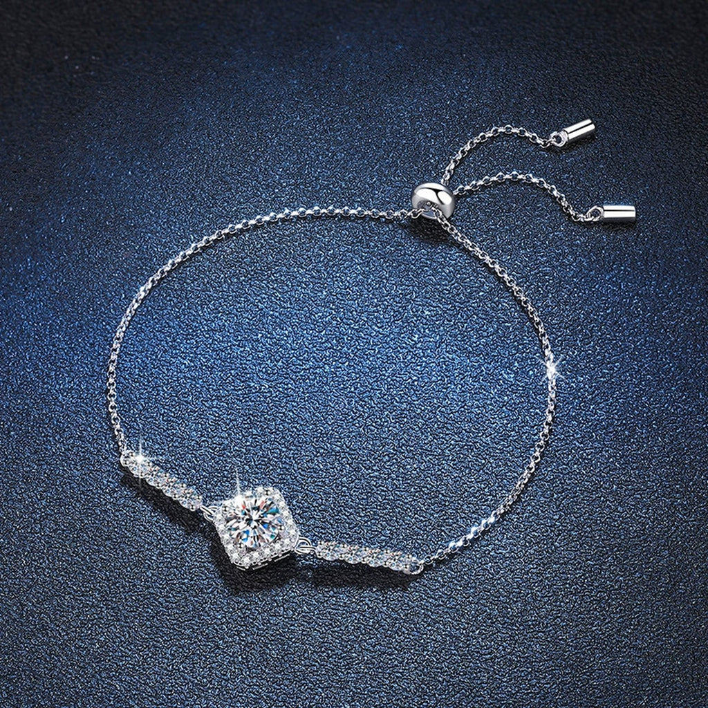 Cushion Moissanite Adjustable Station Bracelet with CZ styled on blue display background with visible moissanite sparkle