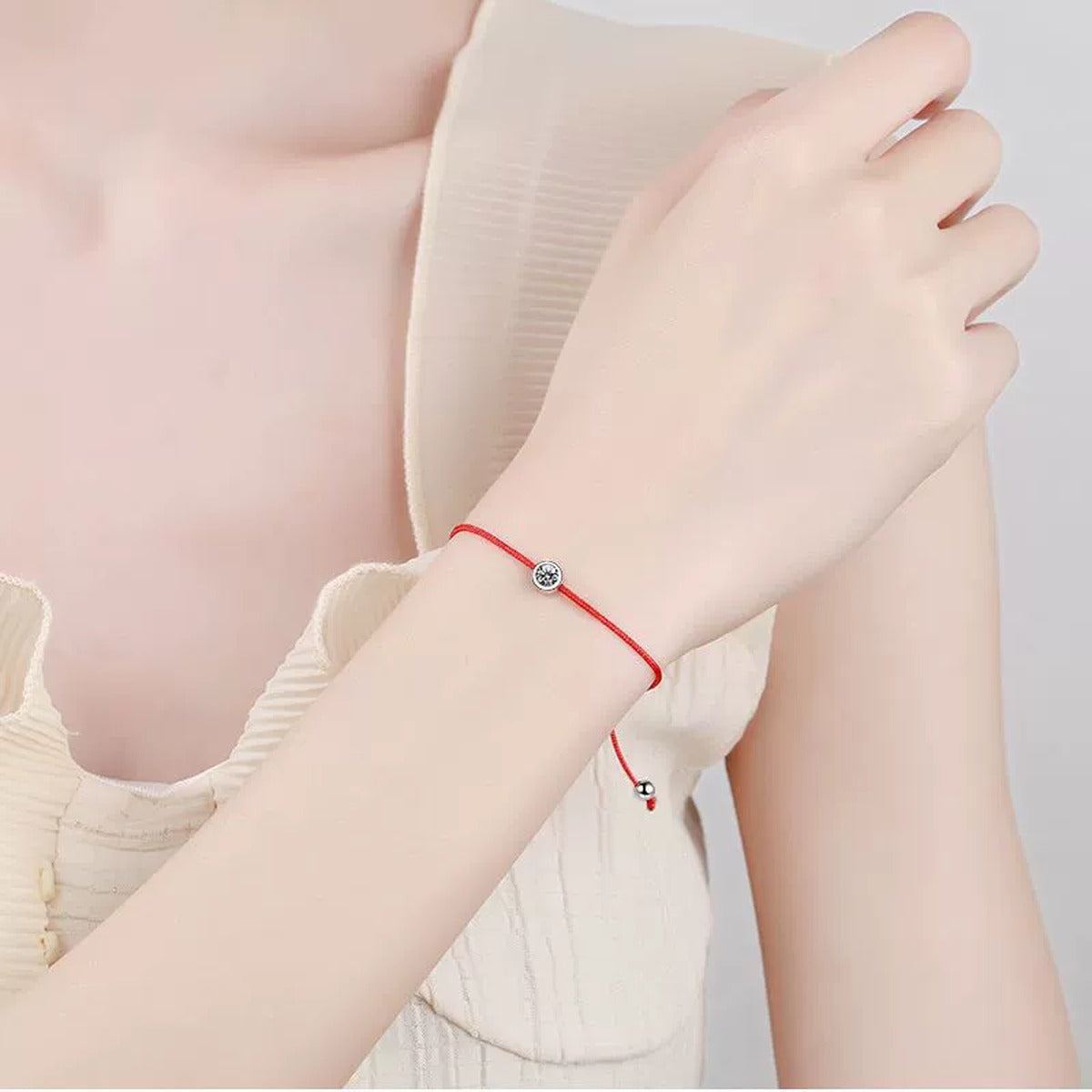 Red Cord Moissanite Adjustable Bracelet worn on wrist by model showing scale and bracelet fit
