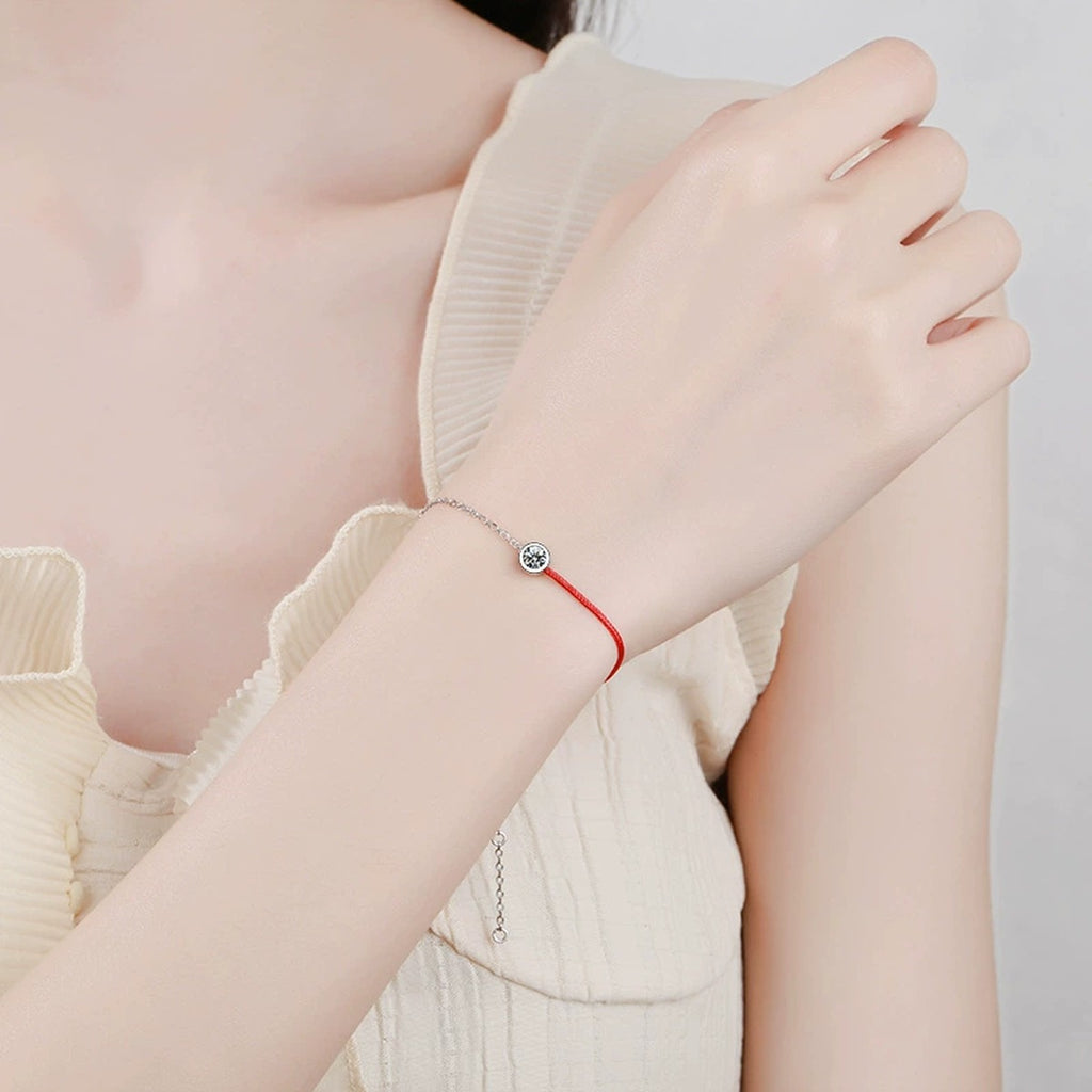 Two-Tone Red Cord Moissanite Adjustable Bracelet worn on wrist by model showing scale and bracelet fit