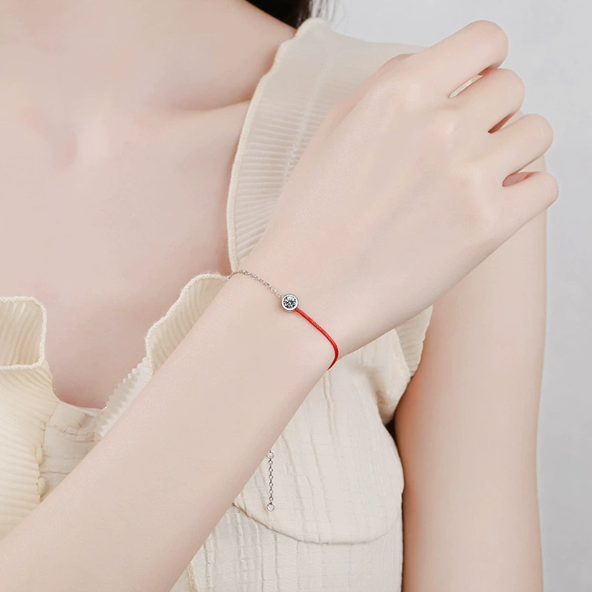 Two-Tone Red Cord Moissanite Adjustable Bracelet worn on wrist by model showing scale and bracelet fit