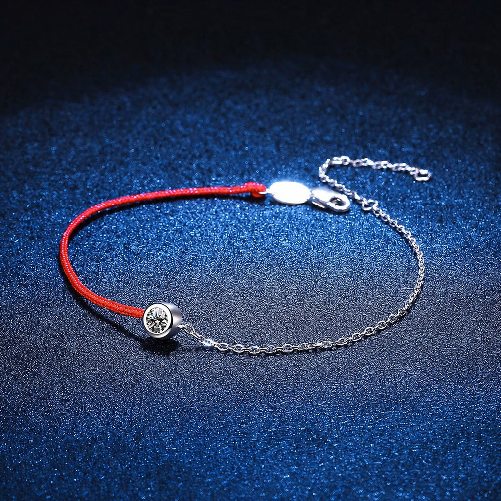 Two-Tone Red Cord Moissanite Adjustable Bracelet styled on blue display background with visible moissanite sparkle