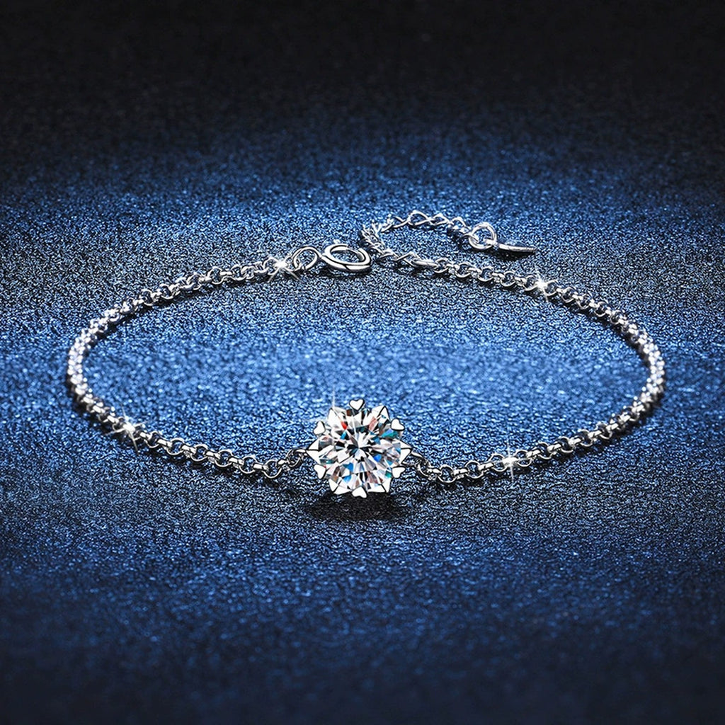 Round Halo Moissanite Chain Bracelet with CZ styled on blue display background with visible moissanite sparkle