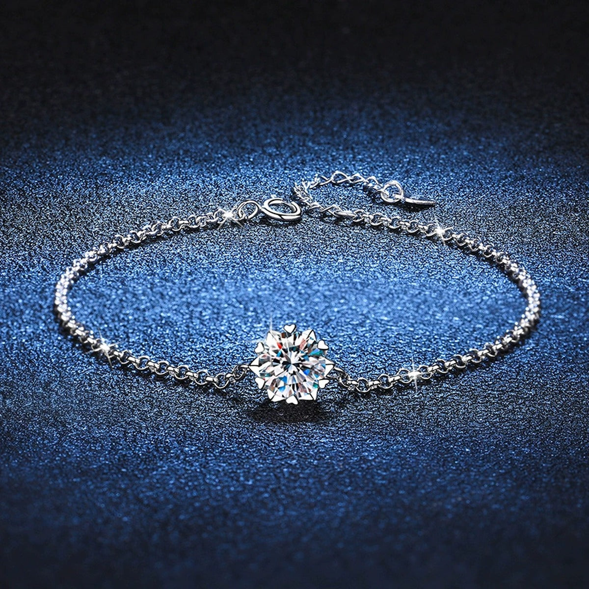 Round Halo Moissanite Chain Bracelet with CZ styled on blue display background with visible moissanite sparkle