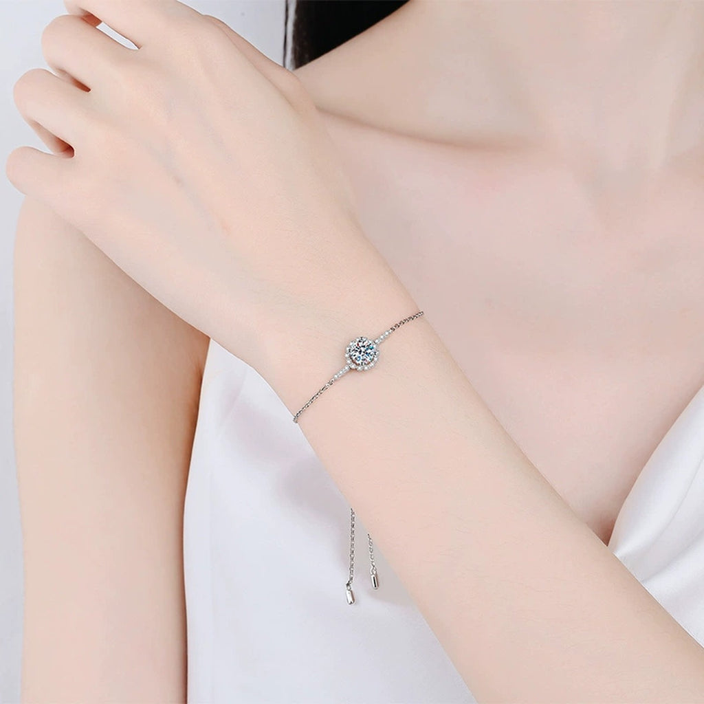 Round Halo Moissanite Adjustable Station Bracelet with CZ worn on wrist by model showing scale and bracelet fit