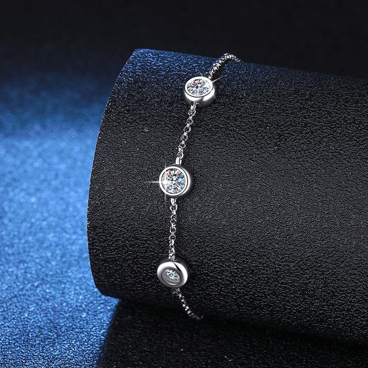 Three-Stone Moissanite Adjustable Station Bracelet close-up bracelet detail showing chain, setting, and stone placement
