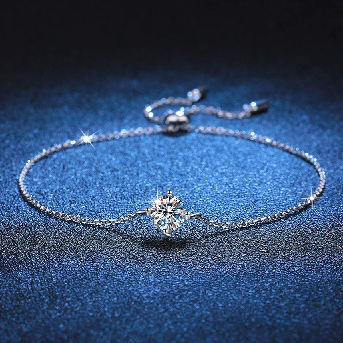 Round Moissanite Adjustable Station Bracelet styled on blue display background with visible moissanite sparkle