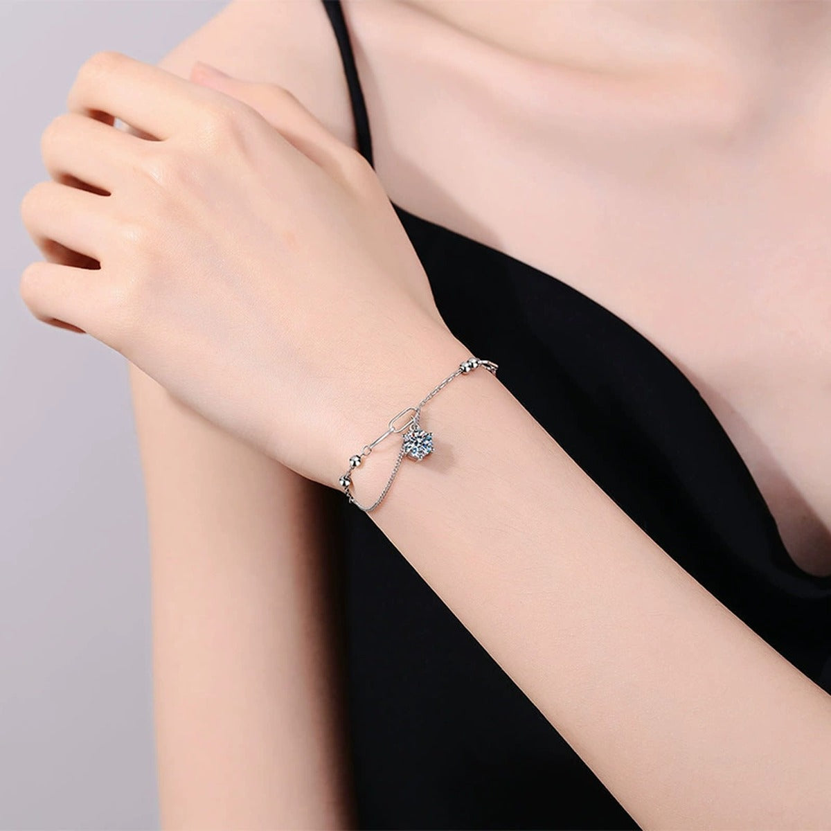 Drop Moissanite Chain Bracelet worn on wrist by model showing bracelet scale and fit