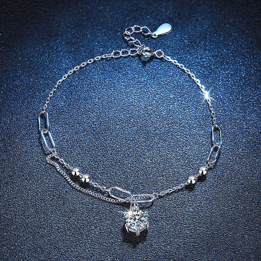 Drop Moissanite Chain Bracelet styled on blue display background showing moissanite sparkle