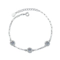 Three-Stone Round Moissanite Chain Bracelet with CZ white background product photo showing bracelet silhouette and moissanite setting