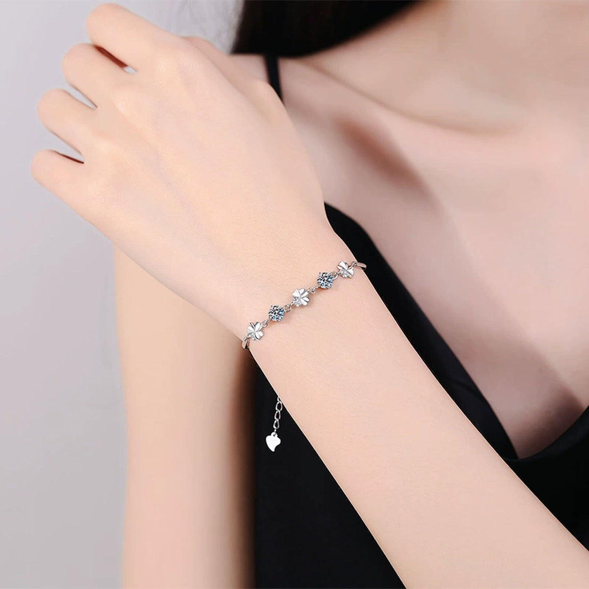Graduated Moissanite Chain Bracelet with CZ white background product photo showing bracelet silhouette and moissanite setting
