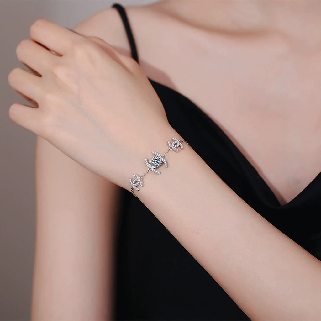 Butterfly Moissanite Chain Bracelet with CZ worn on wrist by model showing bracelet scale and fit