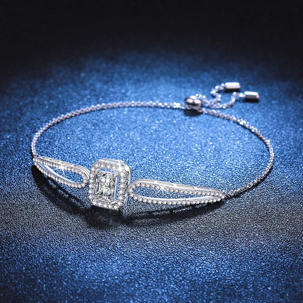 Pear Moissanite Adjustable Bangle Bracelet with CZ worn on wrist by model showing bracelet scale and fit