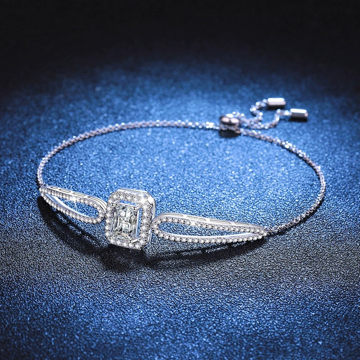 Pear Moissanite Adjustable Bangle Bracelet with CZ worn on wrist by model showing bracelet scale and fit