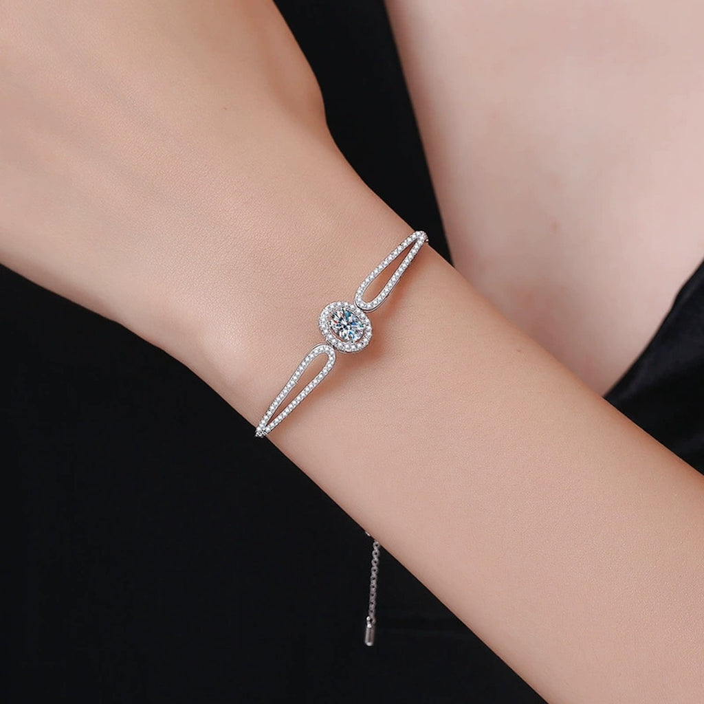 Round Moissanite Adjustable Bangle Bracelet with CZ worn on wrist by model showing bracelet scale and fit