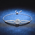 Round Halo Moissanite Adjustable Bangle Bracelet with CZ white background product photo showing bracelet silhouette and moissanite setting