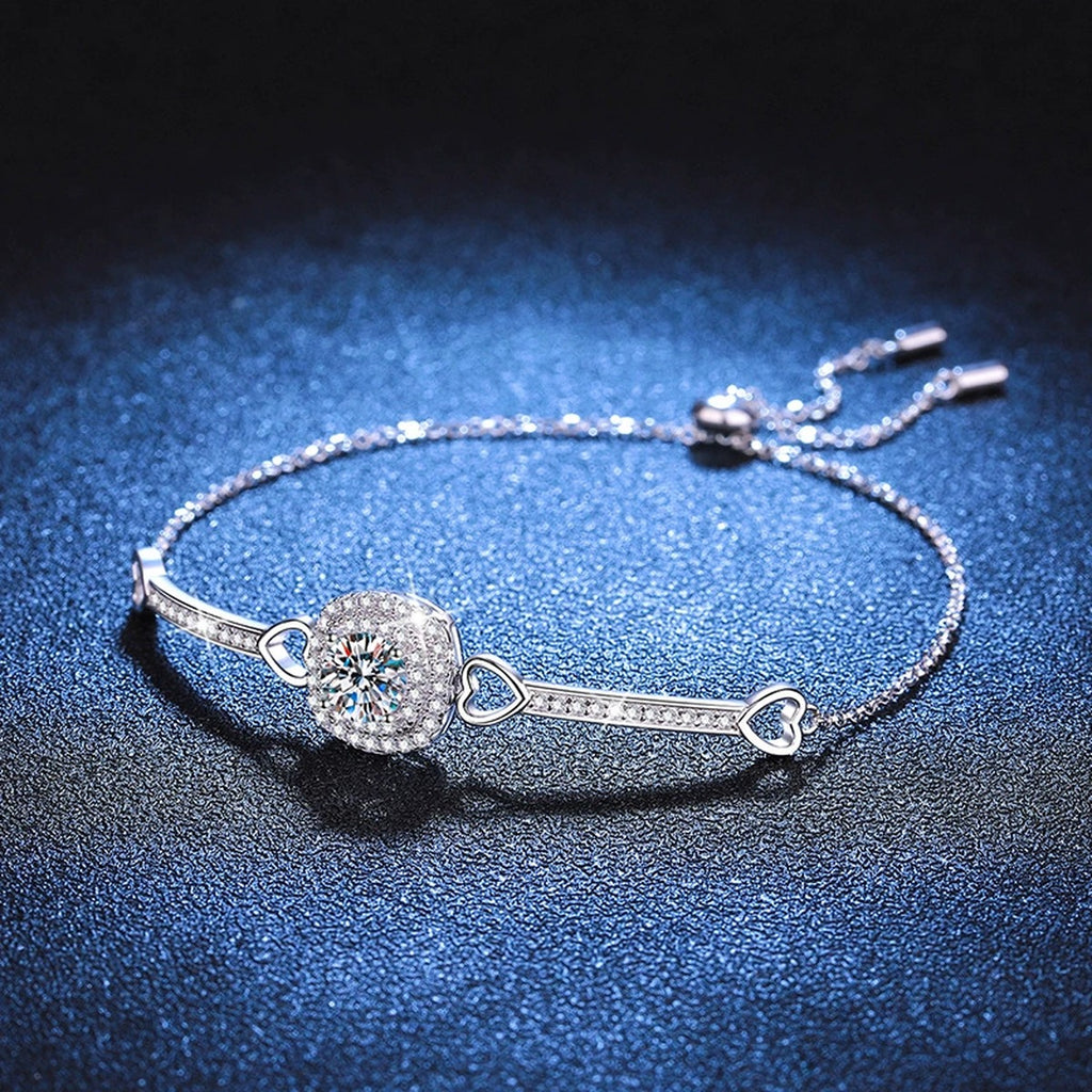 Round Moissanite Adjustable Bangle Bracelet with CZ styled on blue display background showing moissanite sparkle