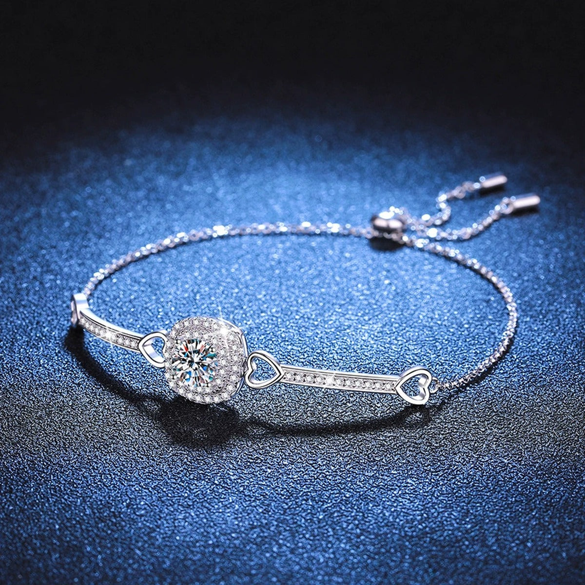 Round Moissanite Adjustable Bangle Bracelet with CZ styled on blue display background showing moissanite sparkle
