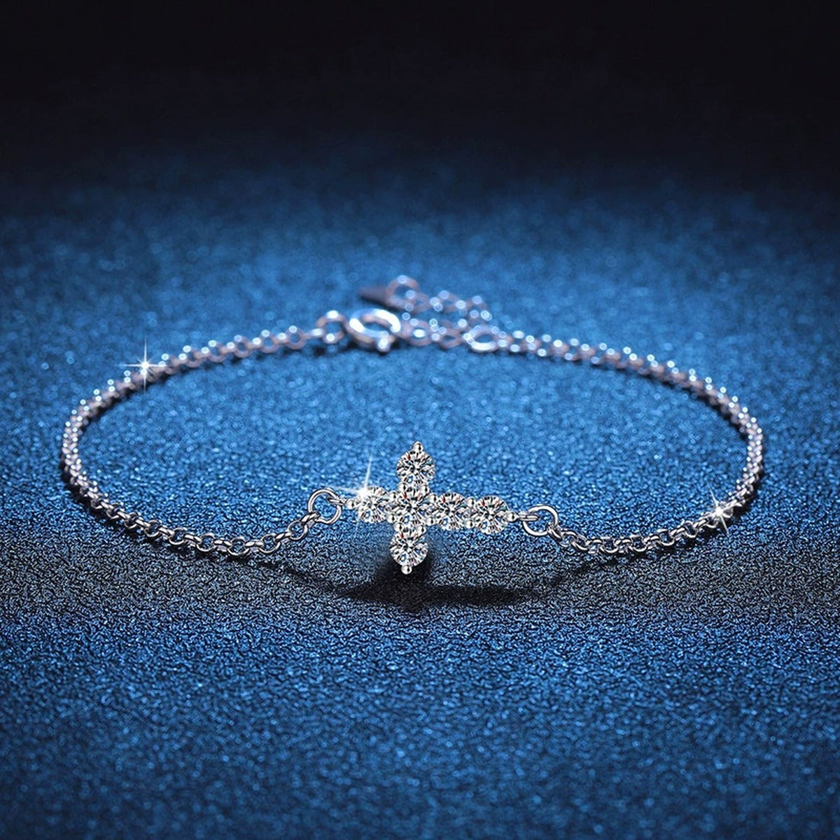 Cross Moissanite Chain Bracelet styled on blue display background showing moissanite sparkle