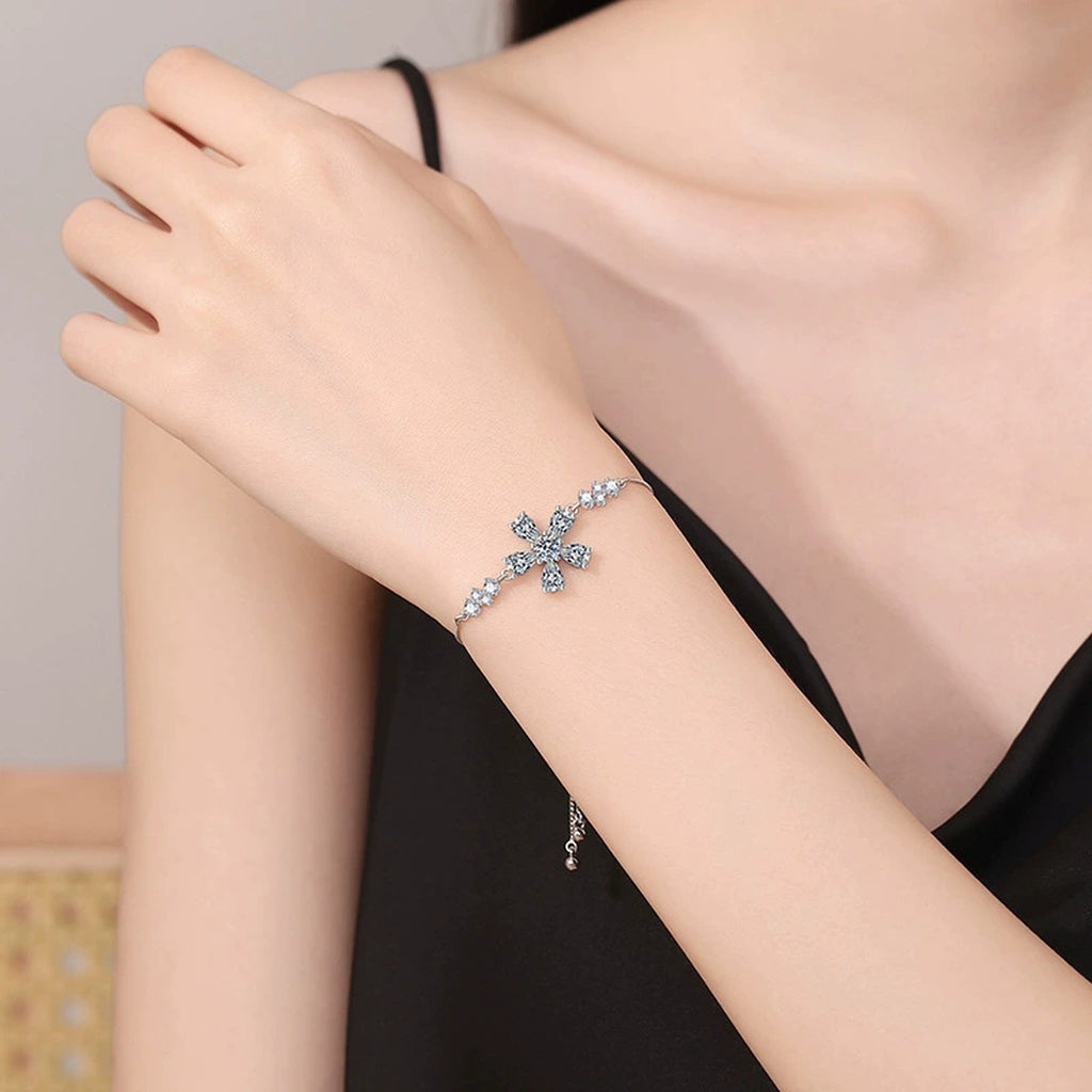 Snowflake Moissanite Chain Bracelet with CZ worn on wrist by model showing bracelet scale and fit