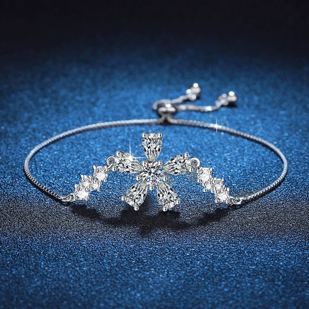 Snowflake Moissanite Chain Bracelet with CZ styled on blue display background showing moissanite sparkle