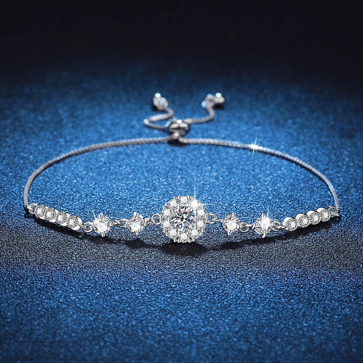 Clover Moissanite Chain Bracelet with CZ styled on blue display background showing moissanite sparkle